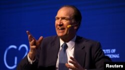 FILE - David Malpass, under secretary for international affairs at the U.S. Department of the Treasury, gestures during a 2018 G-20 conference in Buenos Aires, Argentina, March 18, 2018.