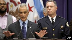 FILE - Chicago Mayor Rahm Emanuel (R) and Police Superintendent Garry McCarthy appear at a news conference in Chicago Nov. 24, 2015.
