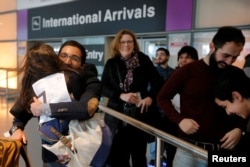 FILE - Behnam Partopour, a Worcester Polytechnic Institute student from Iran, is greeted by his sister Bahar at Logan Airport after he cleared U.S. customs and immigration on an F1 student visa in Boston, Massachusetts, Feb. 3, 2017.