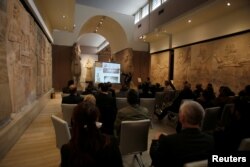 Participants in the Antiquities Protection Workshop attend a lecture in an effort counter heritage crimes and trafficking of artifacts at the Iraqi National Museum in Baghdad, Iraq, Jan. 23, 2019.