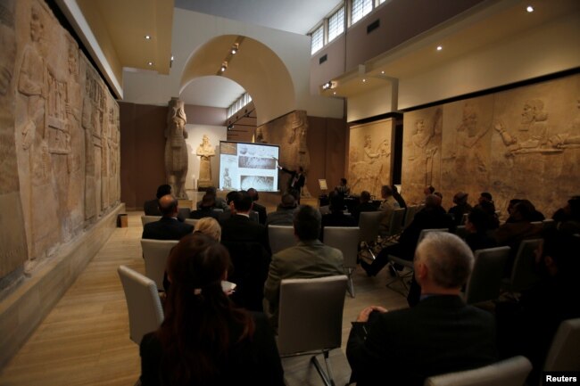 Participants in the Antiquities Protection Workshop attend a lecture in an effort counter heritage crimes and trafficking of artifacts at the Iraqi National Museum in Baghdad, Iraq, Jan. 23, 2019.