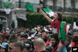 A protester chants slogans during a demonstration against the country's leadership in Algiers, April 12, 2019.