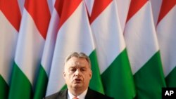 FILE - In this Friday, April 6, 2018 file photo Hungary's Prime Minister Viktor Orban speaks during the final electoral rally of his Fidesz party in Szekesfehervar, Hungary. 