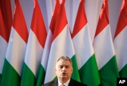 FILE - In this Friday, April 6, 2018 file photo Hungary's Prime Minister Viktor Orban speaks during the final electoral rally of his Fidesz party in Szekesfehervar, Hungary.