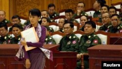 Aung San Suu Kyi walks to take her oath at the lower house of parliament in Burma. (File)