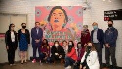 "I Still Believe in Our City" public art installation byAmanda Phingbodhipakkiya (front row in red jacket) is showcased in New York's subway station.