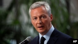 FILE - France's Finance Minister Bruno Le Maire delivers his statement at Bercy ministry, in Paris, May 15, 2018.