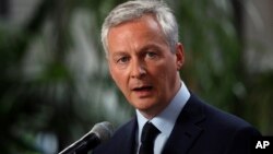 FILE - France's Finance Minister Bruno Le Maire delivers his statement at Bercy ministry, in Paris, May 15, 2018.