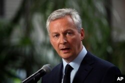 FILE - French Finance Minister Bruno Le Maire speaks in Paris, May 15, 2018.