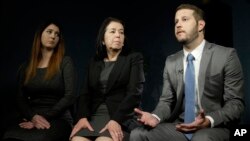 FILE - Christine Levinson (center) wife of Robert Levinson, and her children, Dan and Samantha Levinson, talk to reporters in New York, Jan. 18, 2016. 