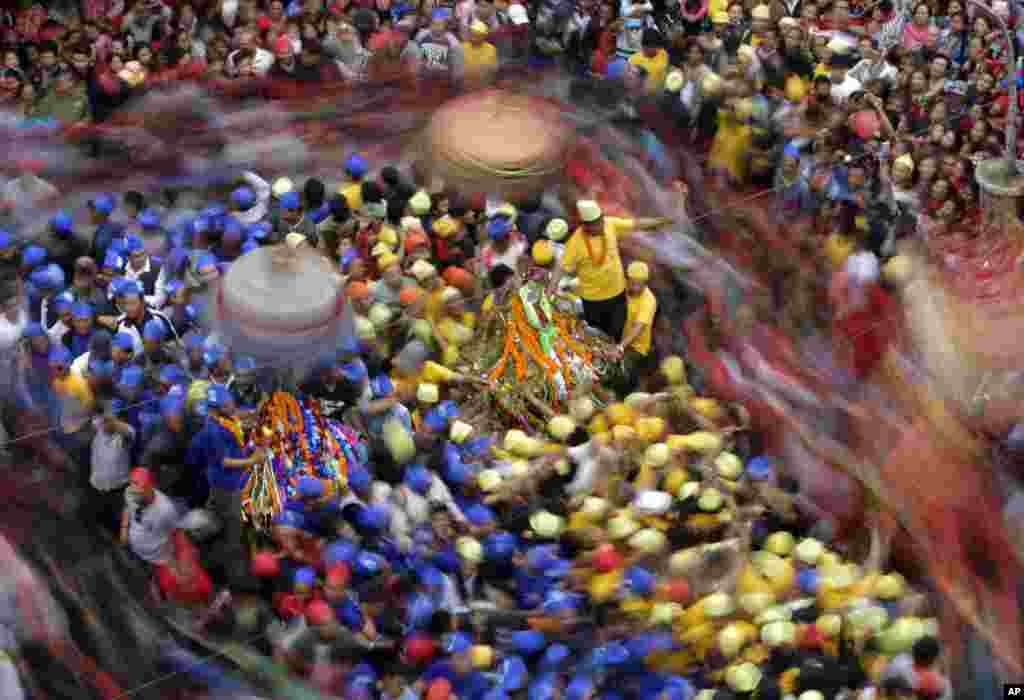 Nepalese devotees participate in the Panch Areh chariot festival in Kathmandu, Nepal.