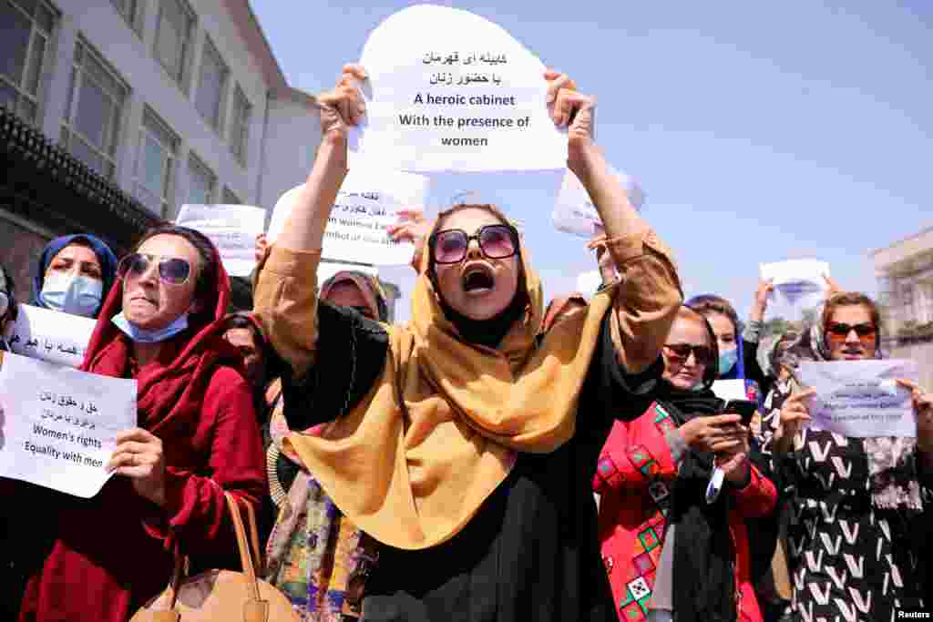 Afghan women&#39;s rights defenders and civil activists protest to call on the Taliban for the preservation of their work and education, in front of the presidential palace in Kabul, Afghanistan.