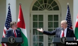 U.S. President Donald Trump, right, and Jordan's King Abdullah II hold a joint news conference in the Rose Garden at the White House in Washington, April 5, 2017.
