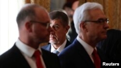 Prime Minister Andrej Babis walks past newly appointed members of the Czech government during the cabinet's inauguration at Prague Castle in Prague, Czech Republic, Dec. 13, 2017.