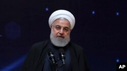 FILE - Iranian President Hassan Rouhani is pictured speaking during a ceremony commemorating "National Day of Nuclear Technology," in Tehran, April 9, 2019.