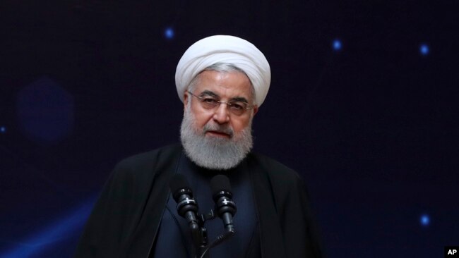 FILE - Iranian President Hassan Rouhani is pictured speaking during a ceremony commemorating "National Day of Nuclear Technology," in Tehran, April 9, 2019.