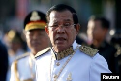 FILE - Cambodia's Prime Minister Hun Sen arrives at the Independence Monument to attend celebrations marking the 65th anniversary of the country's independence from France, in Phnom Penh, Cambodia, Nov. 9, 2018.