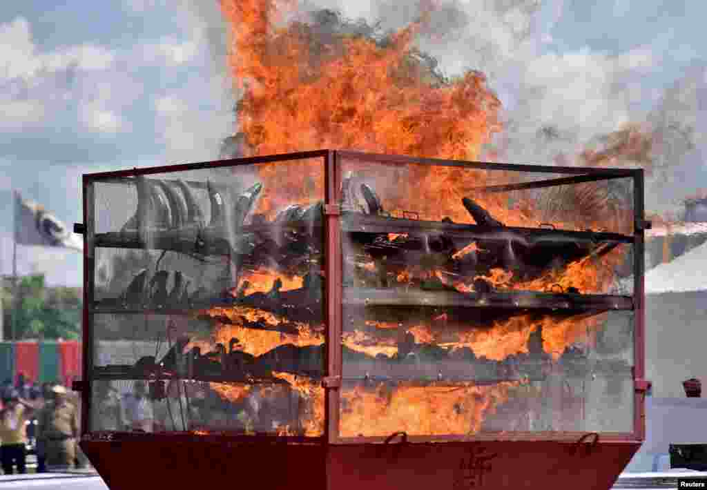 Seized rhino horns are seen burning during an event to mark World Rhino Day in Bokakhat near Kaziranga National Park in the northeastern state of Assam, India.