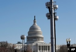 FILE - The West Front of the Capitol in Washington is shown Dec. 28, 2016, with temporary communications towers as preparations continue for inauguration of President-elect Donald Trump.