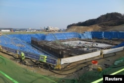 FILE - A general view of the construction site of Gangneung Ice Arena which will be a venue for the figure skating and short track competitions during the 2018 Winter Olympic Games, in the coastal cluster of PyeongChang.