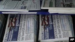 Newspapers, some carrying the story on WikiLeaks' release of classified US State Department documents, are displayed at a newsstand in central London, 29 Nov 2010