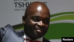 Solly Msimanga of the Democratic Alliance smiles at his supporters after being officially installed as the new mayor of Tshwane, South Africa, Aug. 19, 2016.