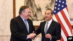 အမေရိကန် နိုင်ငံခြားရေး ဝန်ကြီး Mike Pompeo နဲ့ တရုတ် နိုင်ငံခြားရေး ဝန်ကြီး Wang Yi 