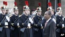 Guinea President Alpha Conde reviews an honor guard at his arrival at the Elysee Palace, in Paris for a meeting with French President Nicolas Sarkozy (File Photo - March 23, 2011)