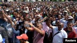 Madagascar demonstrators from the opposition chant slogans as they protest after the president denounced unrest in which two people were killed as a "coup" intended to divide the country's people in Antananarivo, Madagascar, April 23, 2018. 