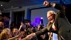 FILE - Tim Walz celebrates being elected to his first term as Minnesota's governor, in St. Paul, Minnesota, Nov. 6, 2018.