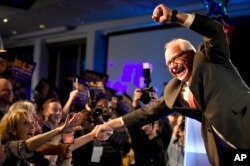 Minnesota Governor-elect Tim Walz celebrates during the election night event by the Democratic Party, Nov. 6, 2018, in St. Paul, Minn.