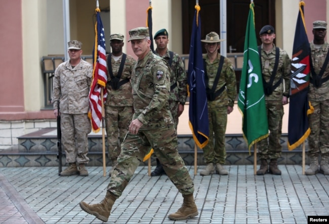 FILE - Commander of NATO Resolute Support forces and United States forces in Afghanistan, U.S. Army General John Nicholson walks during a change of command ceremony in Resolute Support headquarters in Kabul, Afghanistan, March 2, 2016. U.S.-led NATO forces ended their combat mission in Afghanistan at the end of 2014 but continue to provide training and support.