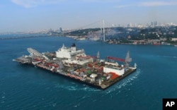 The 'Pioneering Spirit' vessel crosses the Bosphorus Strait in Istanbul, May 31, 2017. The strait was closed to traffic due to the transiting of the vessel, which will carry out the construction of a Turkish natural gas offshore pipeline.