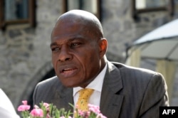 The leader of the DRC opposition party Engagement for Citizenship and Development, Martin Fayulu, talks to the media on June 10, 2016 in Genval, outside Brussels.