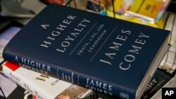 A copy of former FBI Director James Comey's new book, "A Higher Loyalty: Truth, Lies and Leadership," is on display, Apr. 13, 2018, in New York. 