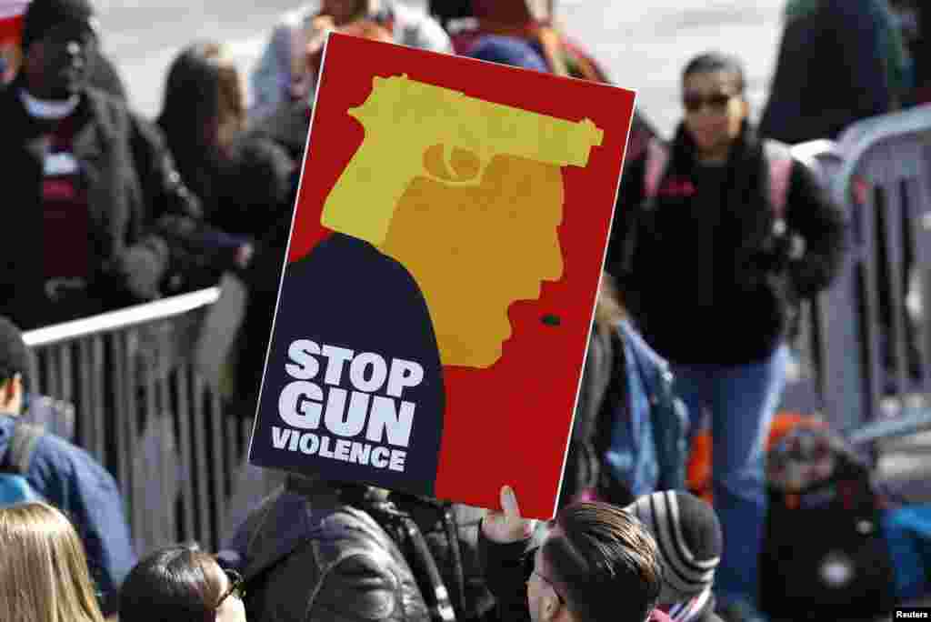 Participants hold up signs as students and gun control advocates hold the &quot;March for Our Lives&quot; event demanding gun control after recent school shootings at a rally in Washington, U.S., March 24, 2018. (REUTERS/Aaron P. Bernstein)