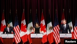 FILE - Canada's Foreign Minister Chrystia Freeland, center, addresses the media with Mexico's Economy Minister Ildefonso Guajardo, left, and U.S. Trade Representative Robert Lighthizer at the close of the third round of NAFTA talks involving the United States, Mexico and Canada.