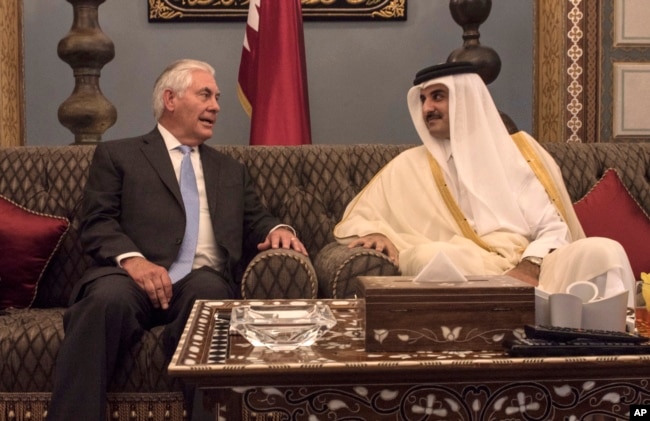 FILE - U.S. Secretary of State Rex Tillerson meets with the emir of Qatar, Sheikh Tamim bin Hamad Al Thani, at the Sea Palace in Doha, Qatar, July 11, 2017.