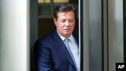 FILE - Paul Manafort, President Donald Trump's former campaign chairman, leaves the federal courthouse in Washington, Feb. 14, 2018.