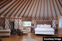 This is the wood-framed yurt where Lisa stayed on her glamping trip.