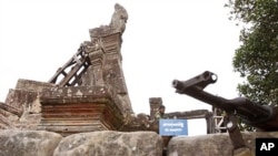 A weapon is placed on the stone at the entrance of Cambodia's famed Preah Vihear temple, a UNESCO World Heritage site, in Preah Vihear province, about 245 kilometers (152 miles) north of Phnom Penh, Cambodia, February 8, 2011
