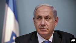 Israeli Prime Minister Benjamin Netanyahu listens during a press conference in Jerusalem about a US-drafted deal to renew a freeze on new construction in West Bank settlements, 15 Nov 2010