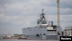 FILE - One of the two Mistral-class warships Russia had ordered from France is seen at the STX Les Chantiers de l'Atlantique shipyard in Saint-Nazaire, western France, April 24, 2014. 