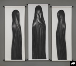 Chinese-born artist Hong Zhang's charcoal images of long, straight hair, examine her identity as an Asian-American woman.