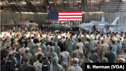 U.S. Vice President Mike Pence speaks to the troops gathered in a hangar at Yokota Air Base Japan, Feb. 8, 2018. A pair of U.S. Air Force F-35 jets flank the vice president.