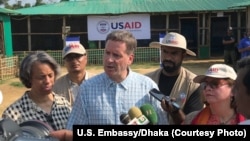 USAID Administrator Mark Green, center, speaks to reporters at the Balukhali Rohingya refugee camp in Cox’s Bazar, Bangladesh, May 15, 2018.