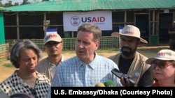 USAID Administrator Mark Green, center, speaks to reporters at the Balukhali Rohingya refugee camp in Cox’s Bazar, Bangladesh. (File)
