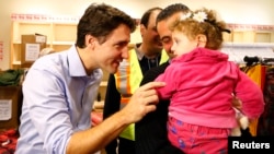 Kanadski premijer Džastin Trudo sa sirijskim izbeglicama