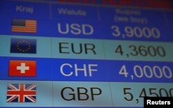 Rates of currencies, including British Pound, United States dollar, Euro and others displayed in London, June 24, 2016 (Reuters)