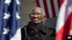 Richard Overton, the oldest living WWII veteran, listens during a ceremony attended by President Obama marking Veteran's Day, Nov. 11, 2013.